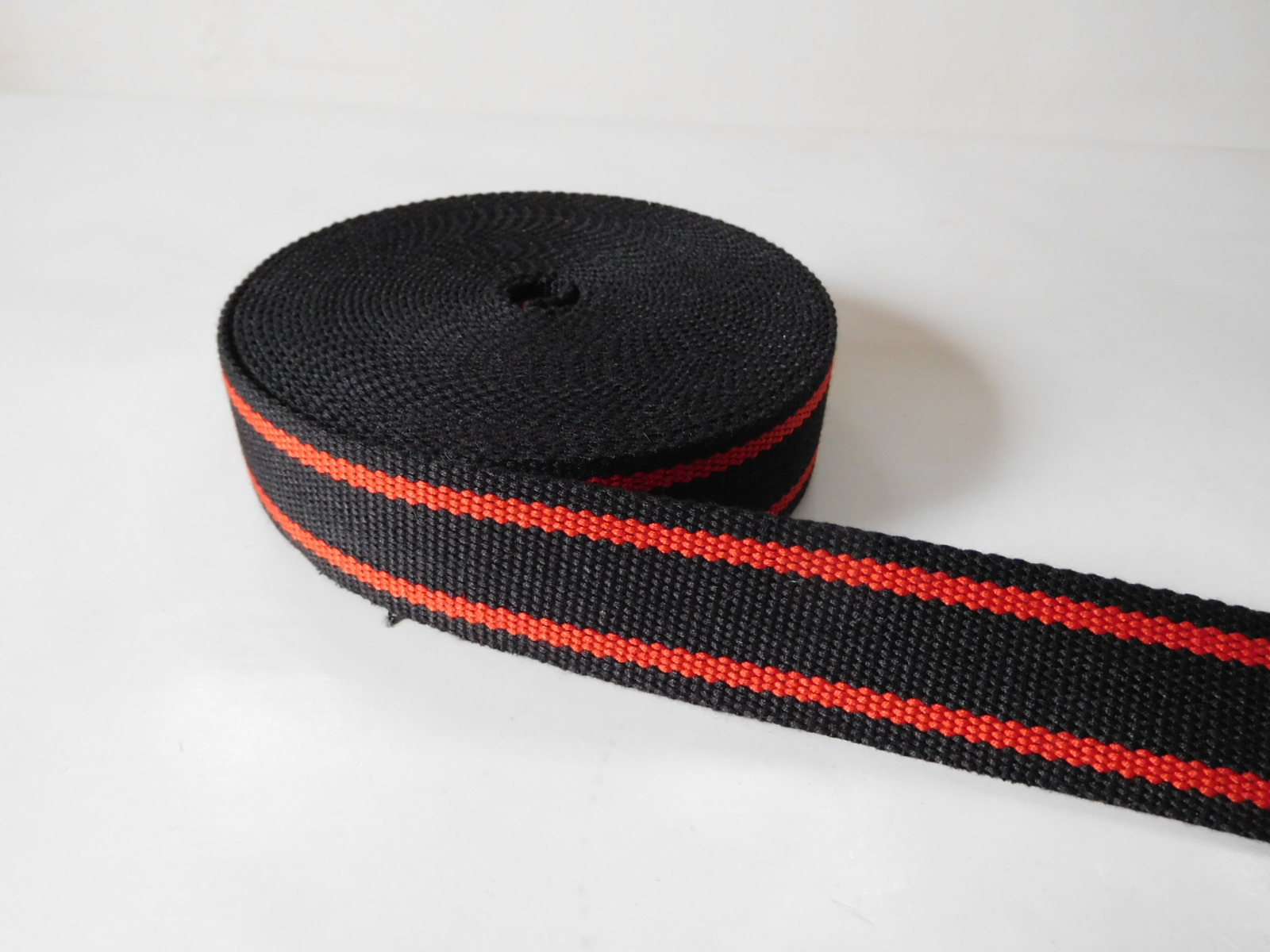Secondary color aramid fiber webbing for fire safety