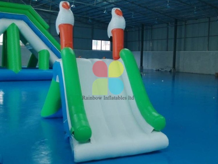 Inflatable Floating island water park games with slide for sale RB32078