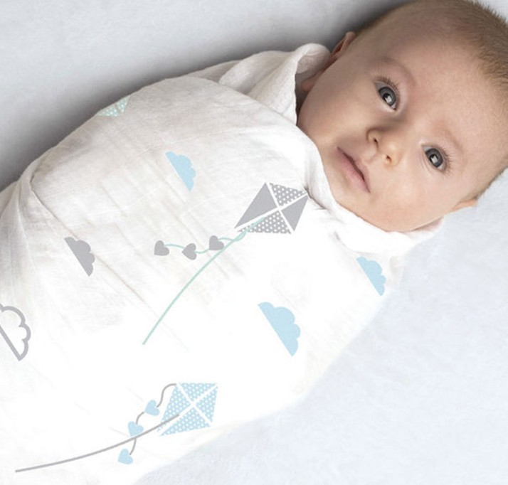 swaddle a baby in a blanket