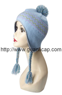 Knitted girl's fashion winter hat with pom-pom