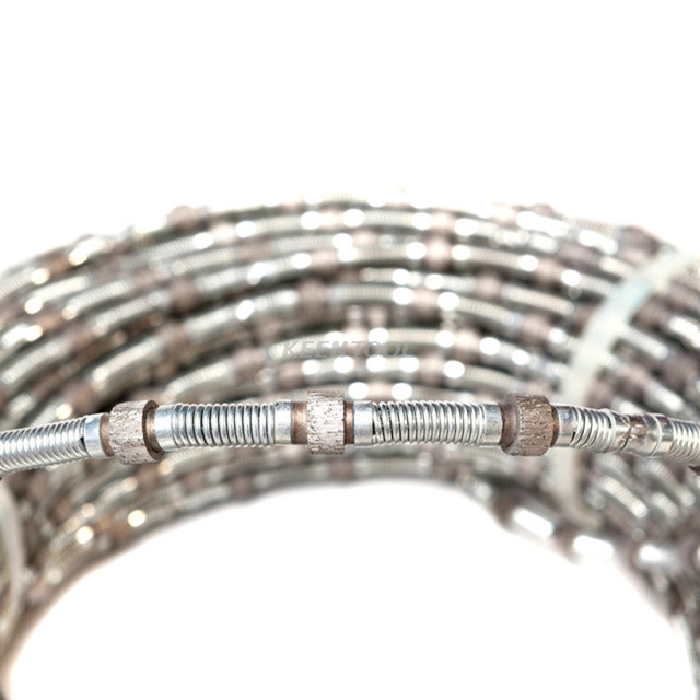 Резка гранитного и мраморного карьеров резиновой и пружинной алмазной проволокой