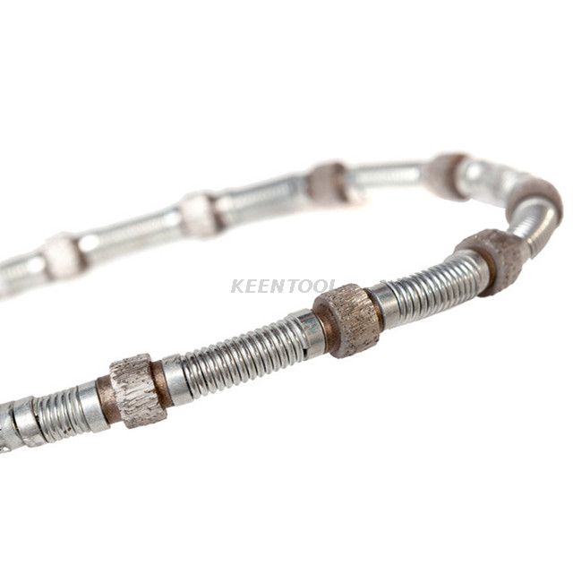 Резка гранитного и мраморного карьеров резиновой и пружинной алмазной проволокой