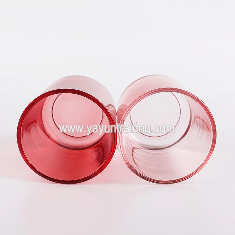 dark and light red glass candle jar