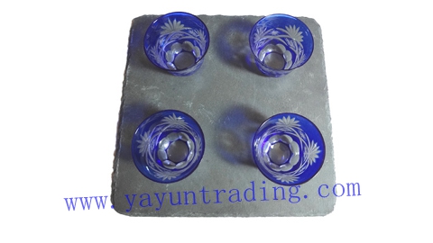 square slate platter with drinking tea cup