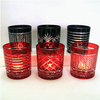 horn shape embossed black and red glass candle jar