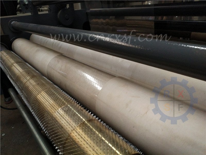 Breathable film slitting and rewinding machine with puncture roller