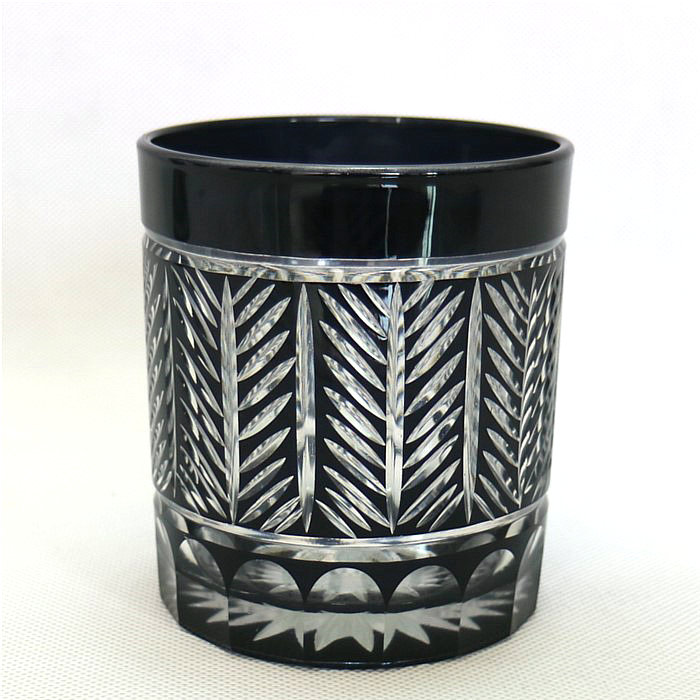 horn shape embossed black and red glass candle jar
