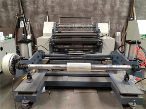 Horizontal slitting machine with slip pneumatic shaft rewinder