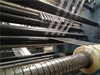 Horizontal slitting machine with slip pneumatic shaft rewinder