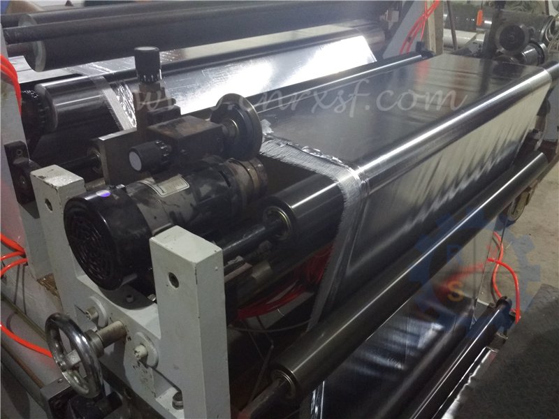 Aluminum foil - woven fabric extrusion laminating machine for fireproof materials