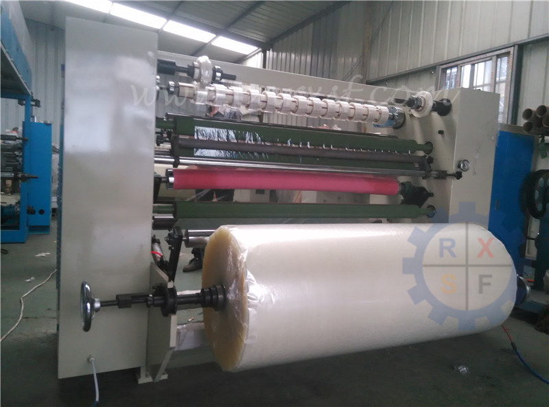 Slitting and rewinding machine for sealing tape