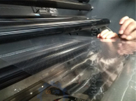 Breathable film slitting and rewinding machine with puncture roller