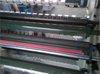 Slitting and rewinding machine for sealing tape