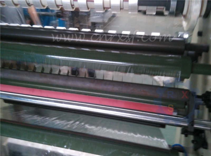 Slitting and rewinding machine for sealing tape