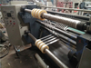 Horizontal slitting machine with slip pneumatic shaft rewinder