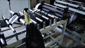 Automatic roll-to-roll rope wearing bag making machine